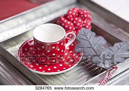Tea cup on a serving tray, close-up View Large Photo Image Stock Photography - Tea cup on a serving tray, close-up . Fotosearch