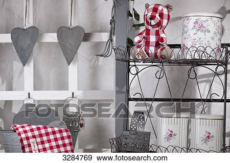Tin cans and teddy bear on a metal shelf View Large Photo Image Stock Photo - Tin cans and teddy bear on a metal shelf . Fotosearch