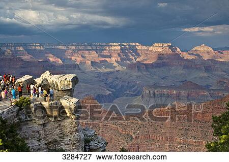 Stock Photo - Tourists at a viewing point, Grand Canyon, South Rim, Arizona, USA, high angle view . Fotosearch