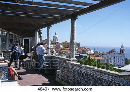 Stock Photo - Tourists at church, Santa Luzia Church, Largo Das Portas Do Sol, Lisbon, Portugal . Fotosearch