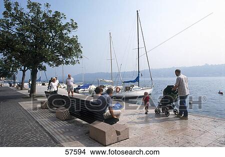 Picture - Tourists at lakefront, Lake Garda, Salo, Lombardy, Italy . Fotosearch
