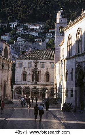 Stock Image - Tourists at palace, Sponza Palace, Dubrovnik, Dalmatia, Croatia . Fotosearch
