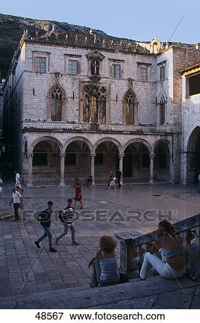 Stock Photo - Tourists at palace, Sponza Palace, Dubrovnik, Dalmatia, Croatia . Fotosearch