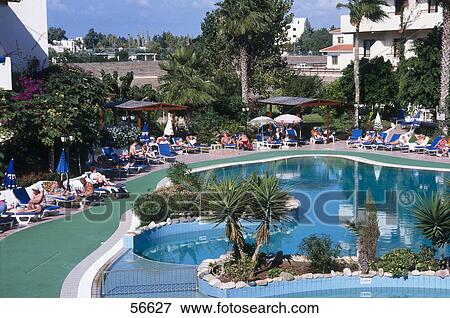 Tourists at poolside, Hotel Theofano, Phaphos, Cyprus  View Large Photo Image Stock Photo - Tourists at poolside, Hotel Theofano, Phaphos, Cyprus . Fotosearch