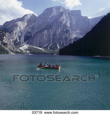 Tourists boating in lake, Pragser Wildsee, Prags, Alto Adige, Italy View Large Photo Image Stock Photo - Tourists boating in lake, Pragser Wildsee, Prags, Alto Adige, Italy . Fotosearch