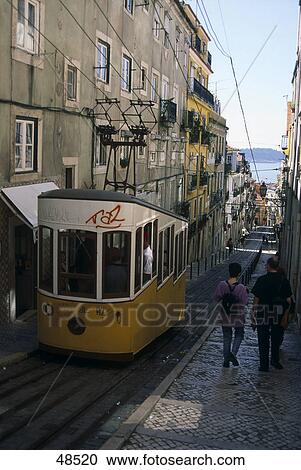 Stock Image - Tram moving on track, Elevador Da Bica, Sao Bento, Lisbon, Portugal . Fotosearch
