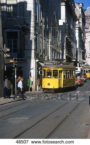 Tram moving on track, Rua Da Conceicao, Baixa, Lisbon, Portugal View Large Photo Image Stock Photo - Tram moving on track, Rua Da Conceicao, Baixa, Lisbon, Portugal . Fotosearch