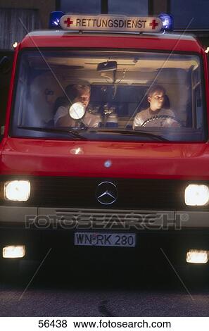Two men sitting in ambulance View Large Photo Image Stock Photo - Two men sitting in ambulance . Fotosearch
