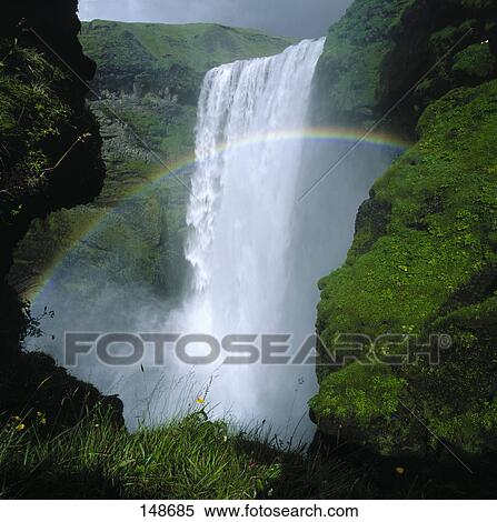 Stock Photography - Waterfall and rainbow, Skogafoss, Iceland . Fotosearch