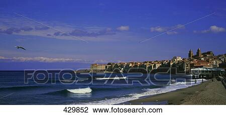 Stock Image - Waves on beach, Cefalu, Sicily, Italy . Fotosearch