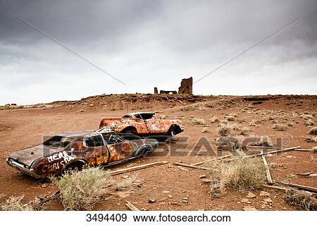 Stock Photo - Wrecked cars in a desert landscape, Arizona, USA . Fotosearch