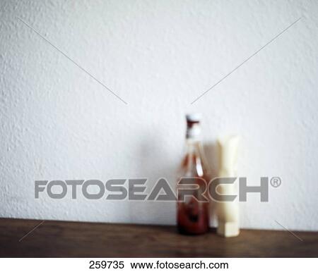 Bottle of tomato ketchup on self View Large Photo Image Stock Photography - Bottle of tomato ketchup on self . Fotosearch