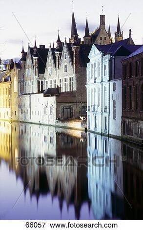 Stock Photo - Buildings at waterfront, Bruges, West Flanders, Belgium . Fotosearch
