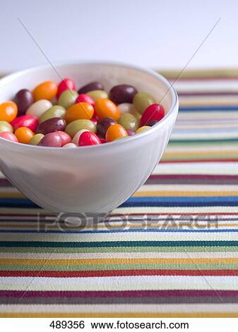 Close-up of colored candies in bowl View Large Photo Image Stock Photograph - Close-up of colored candies in bowl . Fotosearch