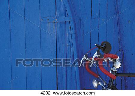 Stock Image - Close-up of handle bar of racing cycle with wooden background, Germany, Europe . Fotosearch