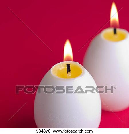 Close-up of lit egg shaped candles View Large Photo Image Stock Image - Close-up of lit egg shaped candles . Fotosearch
