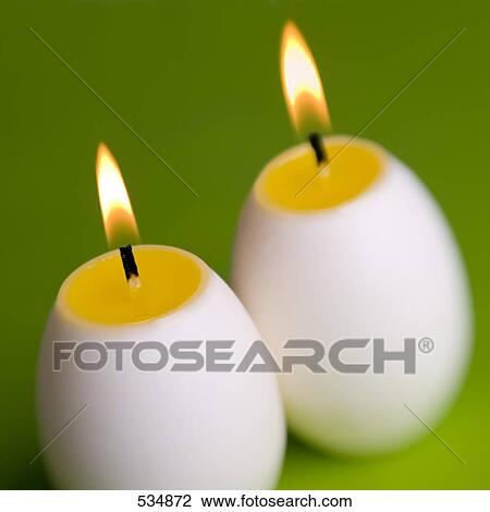 Close-up of lit egg shaped candles View Large Photo Image Stock Image - Close-up of lit egg shaped candles . Fotosearch