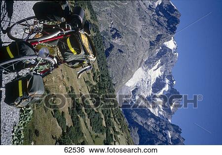 Close-up of mountain bike with mountain range in background, Tyrol, Italy, Europe View Large Photo Image Stock Photograph - Close-up of mountain bike with mountain range in background, Tyrol, Italy, Europe . Fotosearch