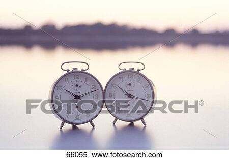 Close-up of two alarm clocks View Large Photo Image Stock Photography - Close-up of two alarm clocks . Fotosearch