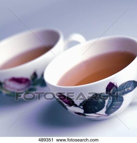 Close-up of two cups of herbal tea View Large Photo Image Stock Image - Close-up of two cups of herbal tea . Fotosearch