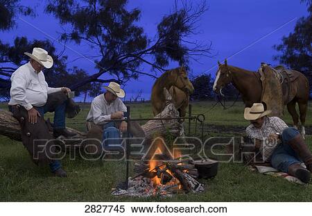 Cowboys resting beside a campfire View Large Photo Image Stock Photography - Cowboys resting beside a campfire . Fotosearch
