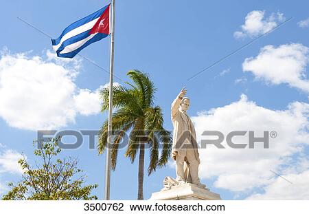 Cuban flag and statue in center of town of Jose Marti, Cienfuegos, Cuba View Large Photo Image Stock Image - Cuban flag and statue in center of town of Jose Marti, Cienfuegos, Cuba . Fotosearch