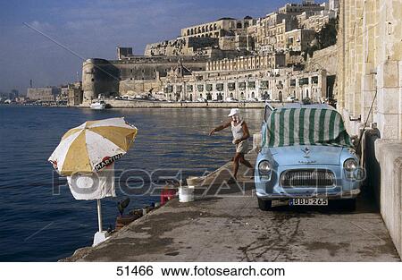 Fisherman near car at harbor, Valletta, Malta View Large Photo Image Stock Photograph - Fisherman near car at harbor, Valletta, Malta . Fotosearch