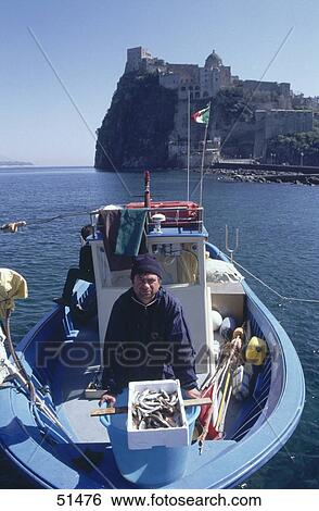 Fisherman on boat in front of castle, Aragonese Castle, Ischia, Italy View Large Photo Image Stock Photograph - Fisherman on boat in front of castle, Aragonese Castle, Ischia, Italy . Fotosearch