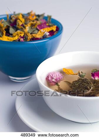 Flowers and herbs floating in bowl View Large Photo Image Stock Photo - Flowers and herbs floating in bowl . Fotosearch
