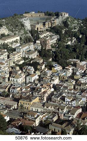 Stock Photograph - High angle view of houses on hill, Taormina, Sicily, Italy . Fotosearch