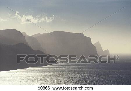 Hill surrounded by fog, Banyalbufar, Majorca, Majorca, Balearic Islands, Spain View Large Photo Image Stock Photograph - Hill surrounded by fog, Banyalbufar, Majorca, Majorca, Balearic Islands, Spain . Fotosearch