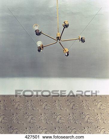 Stock Image - Low angle view of light bulbs . Fotosearch