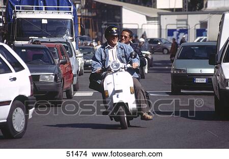 Men riding on scooter, Naples, Italy View Large Photo Image Picture - Men riding on scooter, Naples, Italy . Fotosearch