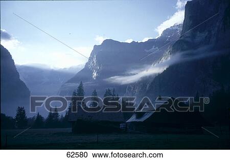 Mountains on mist, Kandersteg, Switzerland, Europe View Large Photo Image Stock Image - Mountains on mist, Kandersteg, Switzerland, Europe . Fotosearch