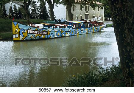 Painted boat in canal, Canal du Midi, France View Large Photo Image Stock Photo - Painted boat in canal, Canal du Midi, France . Fotosearch
