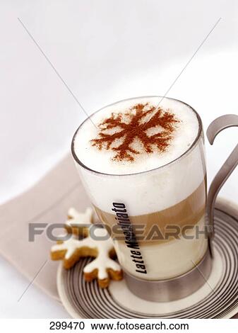 Stock Image - Snowflake decoration on foam in coffee cup . Fotosearch