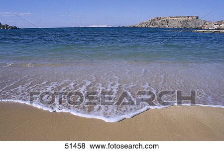 Stock Photo - Surf on beach, Gnejna Bay, Malta . Fotosearch