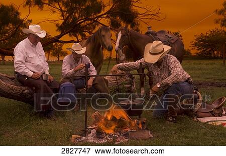 Three cowboys sitting side by side, full shot, USA View Large Photo Image Stock Photo - Three cowboys sitting side by side, full shot, USA . Fotosearch