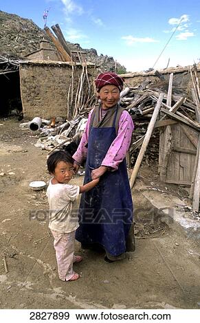 Stock Photo - Tibetan with her child, China . Fotosearch