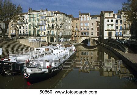 Tour boats in canal, Canal de la Robine, Pont des Merchands, Narbonne, France View Large Photo Image Stock Image - Tour boats in canal, Canal de la Robine, Pont des Merchands, Narbonne, France . Fotosearch