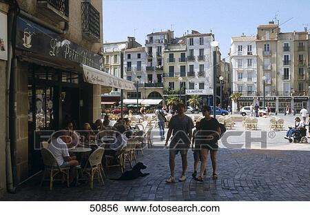 Stock Photograph - Tourists at city street, Place de l´Hotel de Ville, Narbonne, France . Fotosearch