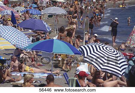 Tourists on beach View Large Photo Image Stock Photograph - Tourists on beach . Fotosearch