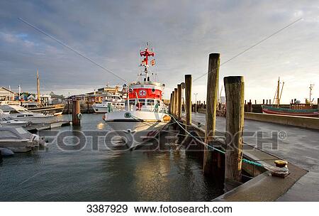 A search and rescue vessel and yachts at the harbour of List, Sylt, Germany View Large Photo Image Stock Photo - A search and rescue vessel and yachts at the harbour of List, Sylt, Germany . Fotosearch