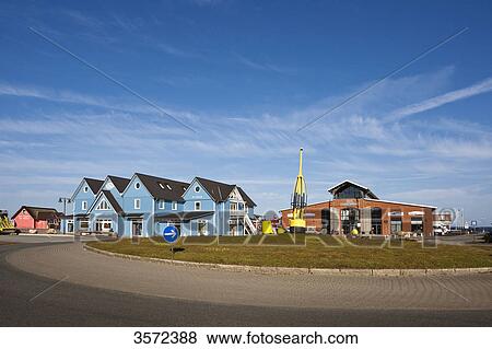 Stock Photo - Alte Tonnenhalle and shops at List Harbor, Sylt, Germany . Fotosearch