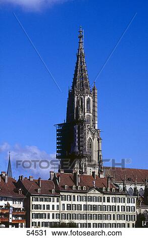 Stock Image - Ancient bell tower against blue sky, Berne, Switzerland . Fotosearch