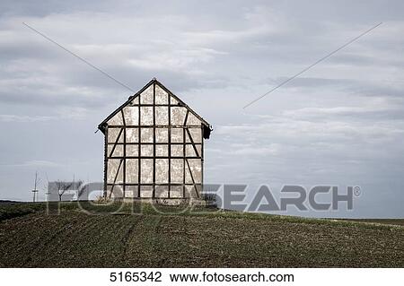 Stock Image - Barn on field . Fotosearch