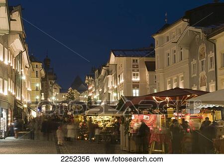 Stock Photograph - Blurred view of people at christmas market, Bavaria, Germany . Fotosearch