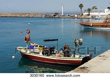Stock Image - Boat in the port of Side, Turkey, high angle view . Fotosearch