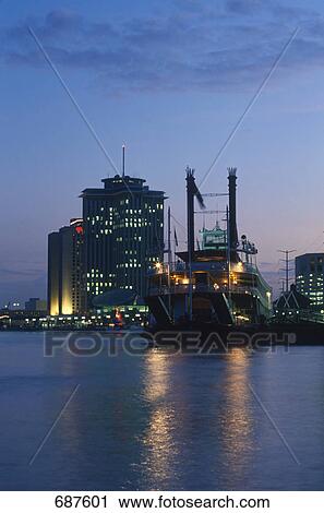 Stock Image - Boat on harbor at dusk, Mississippi River, New Orleans, Louisiana, USA . Fotosearch