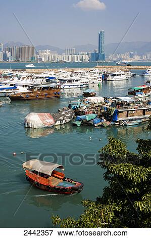 Boats at harbor, Tsim Sha Tsui, Kowloon Peninsula, Hong Kong, China View Large Photo Image Stock Photo - Boats at harbor, Tsim Sha Tsui, Kowloon Peninsula, Hong Kong, China . Fotosearch